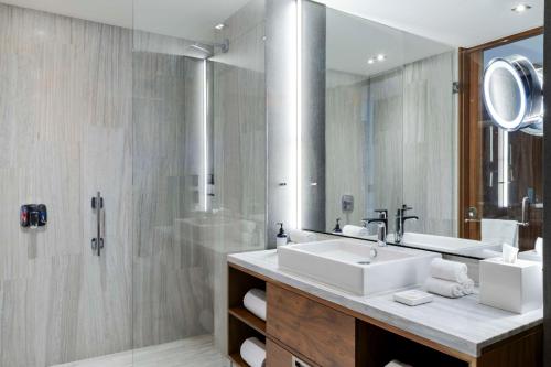 a bathroom with a sink and a shower at Hilton Mexico City Santa Fe in Mexico City