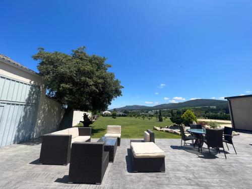 a patio with chairs and a table with a view at Casal de pelaio in Barreiros