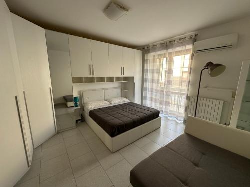 Giường trong phòng chung tại Comfort nel Cuore di Alghero