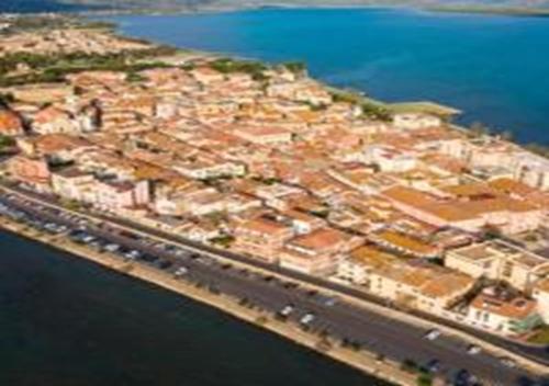 an aerial view of a large city next to the water at App - Il Fenicottero con parcheggio gratuito ad Orbetello in Orbetello