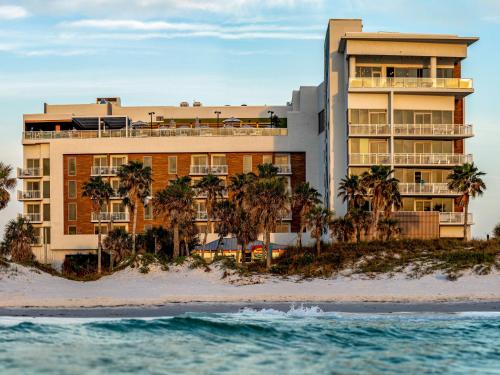 a hotel on the beach next to the ocean at The Hiatus Clearwater Beach, Curio Collection By Hilton in Clearwater Beach