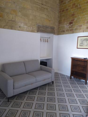 a living room with a couch and a table at Masseria Celentano Relais & Agriturismo in San Severo