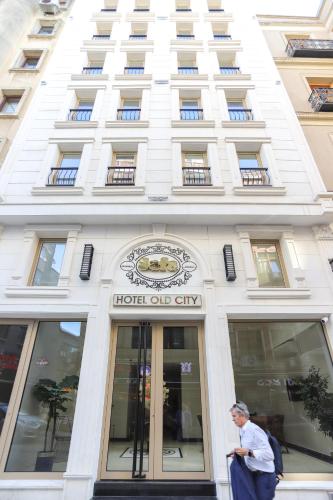 a man standing in front of a hotel one city at Safa Hotel Old City in Istanbul