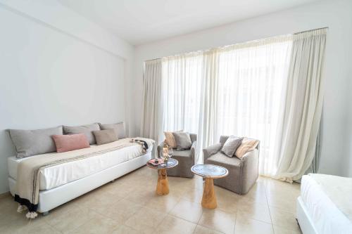 Postel nebo postele na pokoji v ubytování Alpha Urban Suites