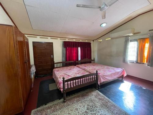 Postel nebo postele na pokoji v ubytování Sandamali rooms