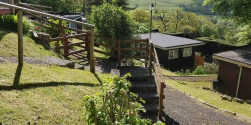 a set of stairs leading up to a house at Springside Chalet20 in Tywyn