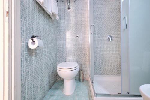 a bathroom with a toilet and a shower at Albergo Della Posta in Bracciano