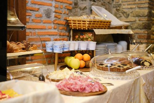 a table with some food on top at Albergo Della Posta in Bracciano