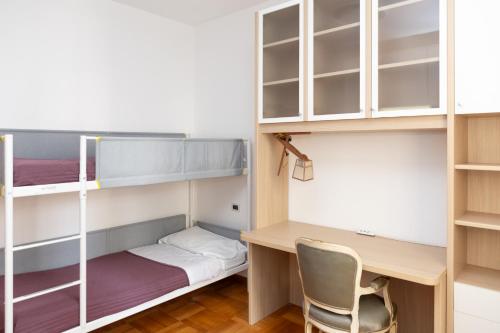 a room with a desk and bunk beds at Di Ale Elegant House in Chioggia