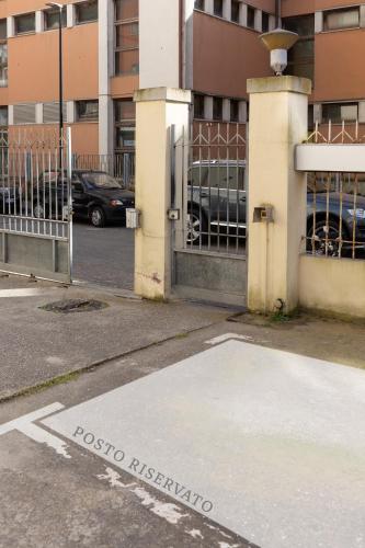 a parking lot with a gate and a parking lot at Di Ale Elegant House in Chioggia