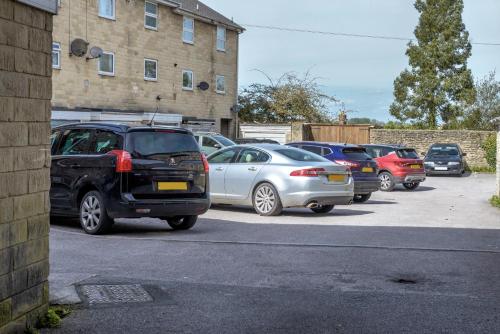 a row of cars parked in a parking lot at The Cornerhouse in Frome