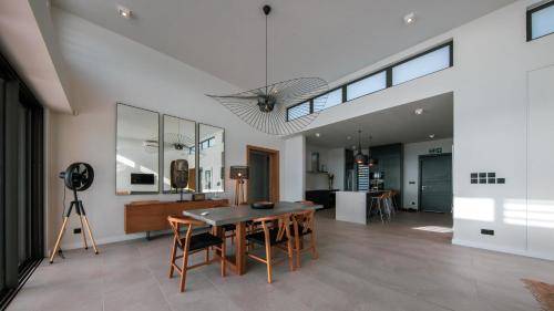 a dining room with a table and chairs at Beach front penthouse in Pereybere in Grand Baie