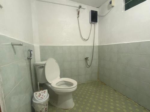 a bathroom with a toilet and a shower at Baguio mountain villa view RW in Baguio