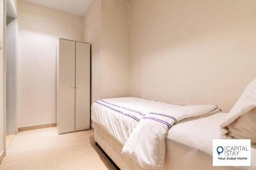 Krevet ili kreveti u jedinici u okviru objekta Capital Stay - 2 Bed Apt - The Address Fujairah