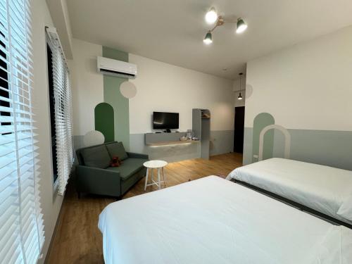 Postel nebo postele na pokoji v ubytování WinXin House