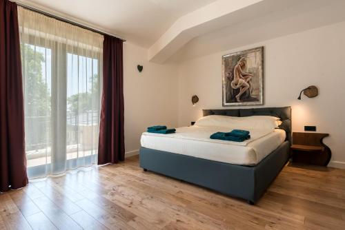Postel nebo postele na pokoji v ubytování Balkida Residence - Balchik Villas