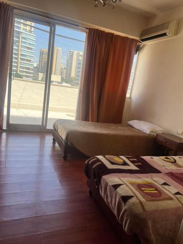 Postel nebo postele na pokoji v ubytování Rawche Universal Apartments