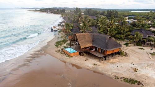 an aerial view of a house on the beach at Sia Sente Beach estate in Inhambane