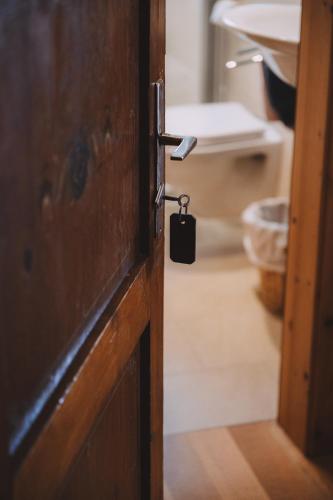 a door with a key in a room at Berghotel Breitmoos in Mittersill