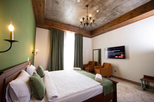 Postel nebo postele na pokoji v ubytování Xinali Hotel