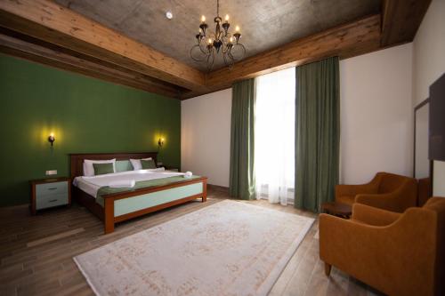 Postel nebo postele na pokoji v ubytování Xinali Hotel