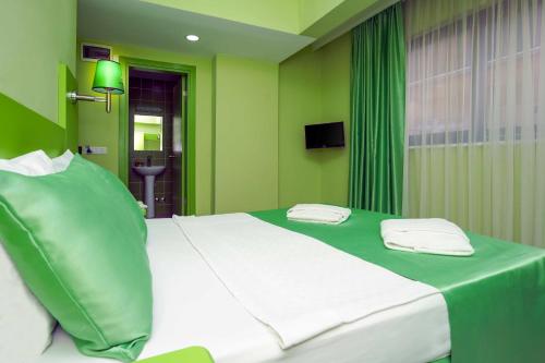 Postel nebo postele na pokoji v ubytování Avlion Boutique Hotel