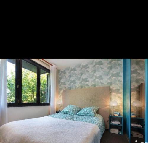 Postel nebo postele na pokoji v ubytování Cocon arboré