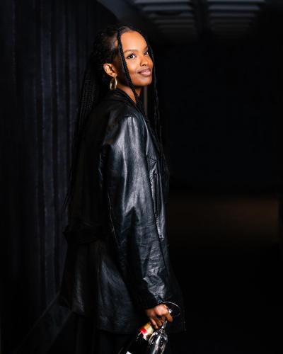 a woman wearing a black leather jacket at Arctic City Hotel in Rovaniemi