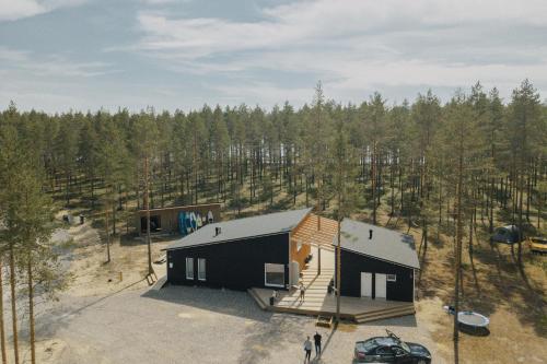 an aerial view of a cabin in the woods at Pistocamp in Puumala