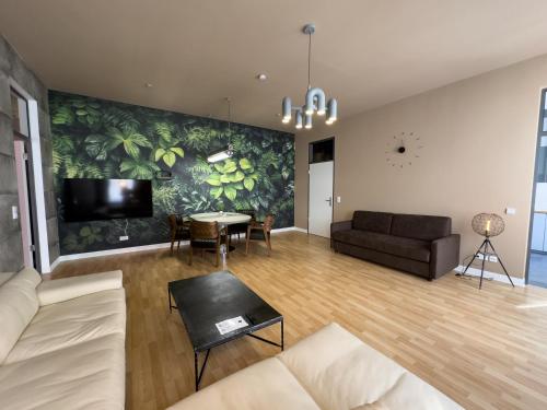 TV a/nebo společenská místnost v ubytování Exklusives Leipzig City Apartment Urban