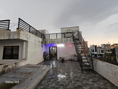 a staircase on the side of a building at Kshipra Home Stays in Ujjain
