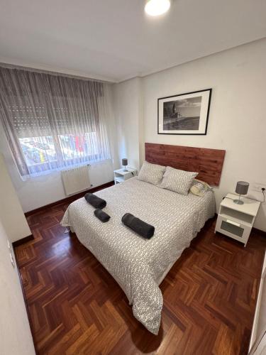 Ένα ή περισσότερα κρεβάτια σε δωμάτιο στο Apartamento centro y playa de Gijon