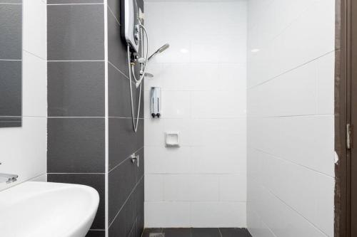 a bathroom with a shower with a toilet and a sink at Dream - Summer @Majestic Condo in Ipoh