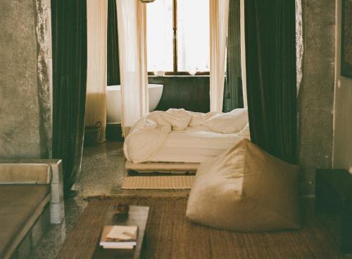 a bedroom with two beds and a window at Mona Athens in Athens
