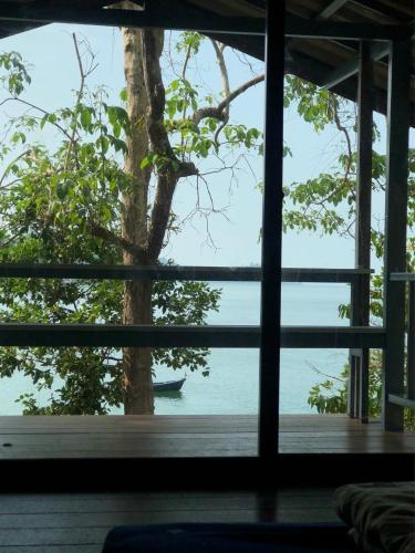 a window view of the ocean from a house at The Big House in Koh Chang Ranong