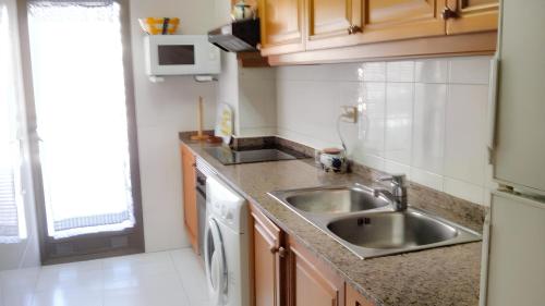 A kitchen or kitchenette at 2 bedrooms apartement with sea view shared pool and furnished terrace at Calpe 1 km away from the beach