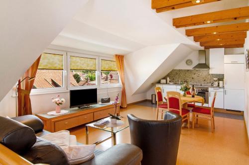 a living room with a couch and a table at Huus Nördernee 2 in Norderney