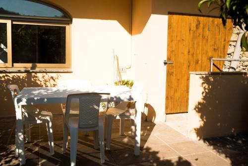 a table and chairs sitting on a patio at Al Beo in Finale Ligure
