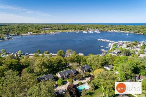 an aerial view of a lake with houses at This Charming 2 bed condo is next to downtown Saugatuck and includes a pool! in Saugatuck