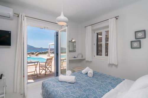 Posteľ alebo postele v izbe v ubytovaní Blu Suites and Studios