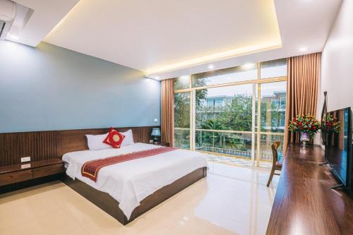 En eller flere senge i et værelse på Villa Sao Biển 15 FLC Sầm Sơn