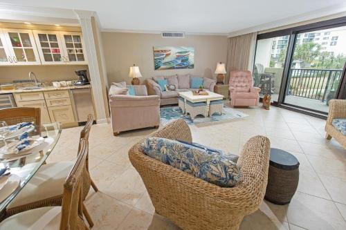 a living room with chairs and a table at 3 Bedroom 2 Bath Sandpiper Condo with Ocean Views in Pawleys Island