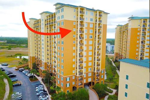 a building with a red arrow on it at Spider-Man-themed condo near Disney, Sea World, Universal and OCCC with pool, spa, restaurants, shuttle, private balcony, and view of fireworks shows in Orlando