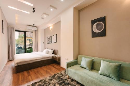 Postel nebo postele na pokoji v ubytování Hanoi-Oi Homestay Cau Go