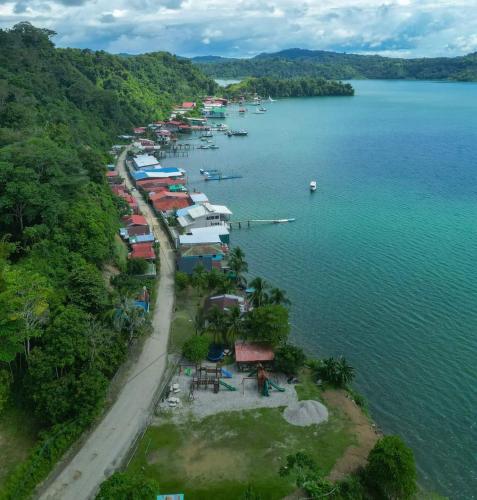 an aerial view of a harbor with boats in the water at Jungle Container Escape in Golfito