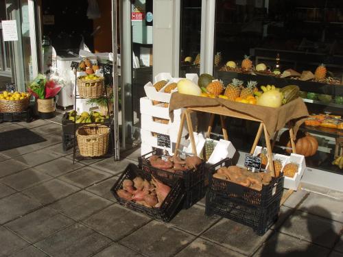 a display of fruits and vegetables on display in a store at Apartment T3 in Downtown with Sea View in Ponta Delgada