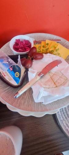a plate of food with meat and vegetables on a table at Mosswood Bed & Breakfast in Graskop