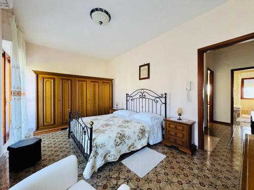 a bedroom with a bed and a dresser in it at Angelina Apt in Piano di Sorrento