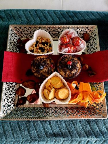 a tray filled with different types of food on a table at Mosswood Bed & Breakfast in Graskop