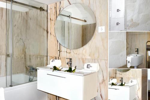 uma casa de banho com um lavatório branco e um espelho. em 2 bedrooms house with terrace and wifi at Riba de Mouro em Riba de Mouro